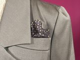 a close up of a suit and tie on a mannequin mannequin