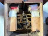 a clock that is made out of wood and has a pendulum
