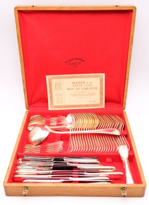 a set of silverware in a wooden box with a red case