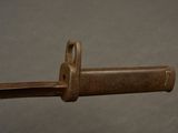a close up of a metal object on a gray surface