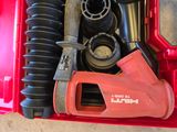 a red tool box with tools in it on the floor