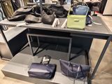 a table with two bags on it and two bags on the table