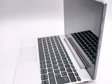 a laptop computer sitting on top of a white table