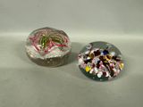 two glass marbles sitting next to each other on a table