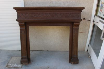 a fire place in front of a building with a door