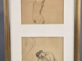 two framed drawings of a woman and a man sitting on the ground