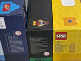 a lot of lego boxes stacked on top of each other