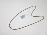 a close up of a gold chain with a tag on it