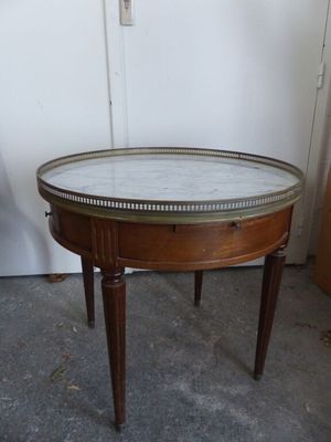 a small table with a marble top on it