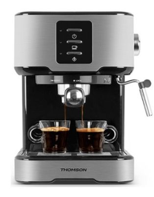 a close up of a coffee machine with two cups of coffee