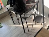 a black backpack sitting on a chair in a room