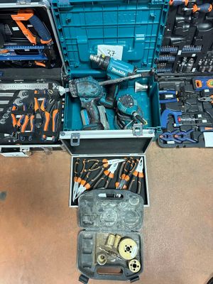 many tools in a case that are sitting on the floor
