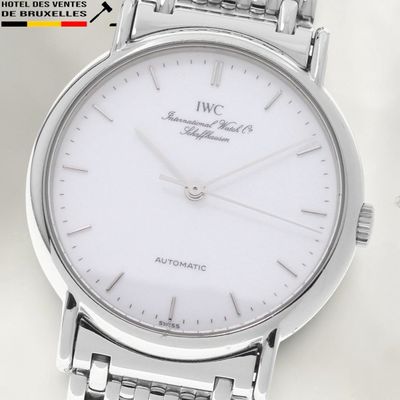 a close up of a wrist watch with a white dial