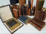 a lot of old books that are sitting on a table