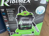 the box of a vacuum cleaner sits on the floor next to a canister