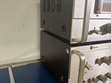 two stereos on top of each other on a blue table