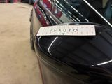 a sticker on the door handle of a car