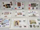 a lot of stamps on the table with pictures on them