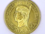 an image of a gold coin with a woman ' s face on it