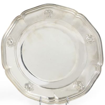 an antique silver plate on a stand on a white background