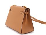 a close up of a tan handbag on a white background