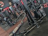 a gym with a lot of machines in the room