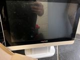 a man taking a picture of himself in the mirror of a computer monitor