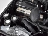 a black suitcase filled with many different types of hair products