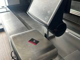 an image of a laptop on a conveyor belt at an airport