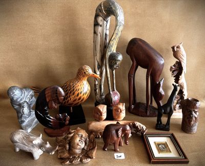a lot of wooden animals that are on a table