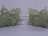 pair of green jade figurines of a fish and a turtle