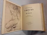 an open book with a drawing of a nude on it