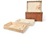 two old suitcases sitting next to each other on a white surface