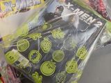 a bag of comic books and a bag of candy on a table
