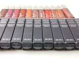 a close up of a bunch of lipsticks sitting on top of each other