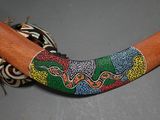 a wooden stick with a colorful design on it