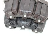 a close up of a baseball glove on a white surface