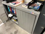 a desk with a printer and some books on top of it