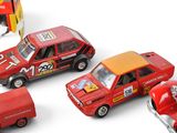 four toy cars that are sitting next to each other