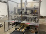 an image of a machine in a factory with a conveyor belt