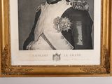 an old picture of a man in a military uniform in a gold frame