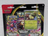 a close up of a box of pokemon cards on a white surface