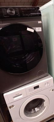 a washer and a dryer in a small room