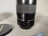 a camera lens sitting on a table next to a coffee cup