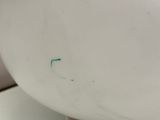 a close up of a white lamp on a table