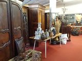 a room with a lot of antique furniture in it