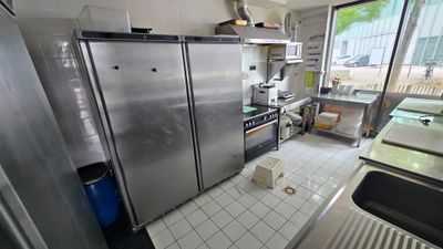 a kitchen with stainless steel appliances and a large window