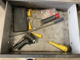 a box with tools inside of it on the floor