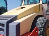 an image of a construction vehicle parked on the side of the road