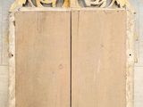 an image of a wooden cabinet sitting on top of a cement floor